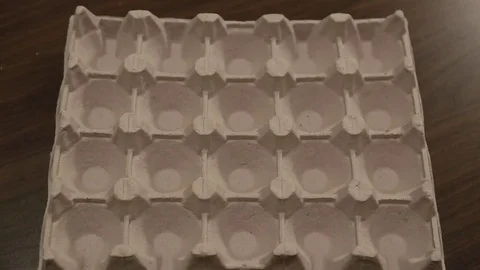 Appearance of white and brown eggs in egg carton cell. Eggs  animation. Stock Footage 84561158