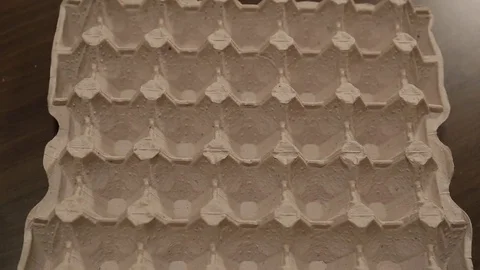 Appearance of white and brown eggs in egg carton cell. Eggs  animation. Stock-Footage 84561279