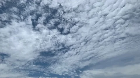 Appearing and disappearing patterns of altocumulus clouds - time lapse Stock Footage 130798913