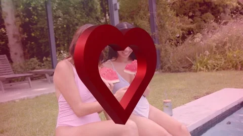 Appearing red 3D heart spinning as two women leaning, sharing phone to view, Stock Footage 334694153