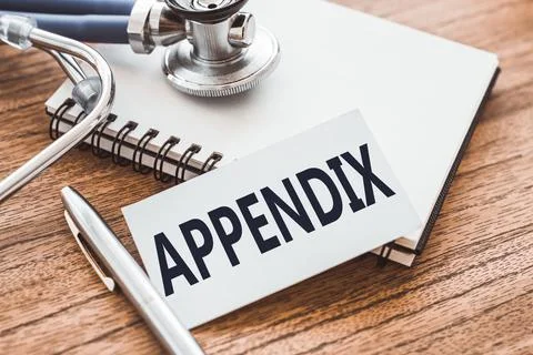 APPENDIX - text on card on wooden table with stethoscope and notepad for medi Stock Photos
