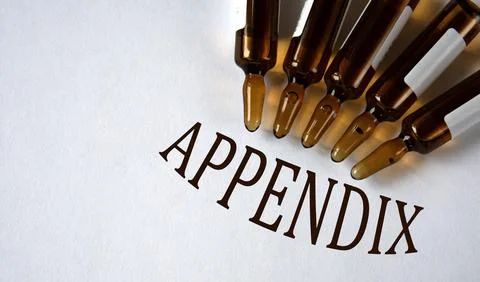APPENDIX - word on white background with brown ampoules 库存照片