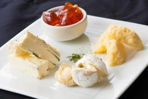 Appetizer of assorted cheeses Stock Photos