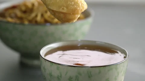 Appetizer being dipped in sauce Video stock 46667987