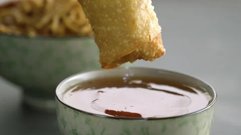 Appetizer being dipped in sauce Stock Footage 46668470