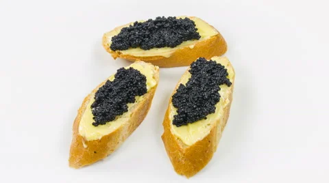 Appetizer with caviar close-up rotation on white background. Stock Footage 63611157