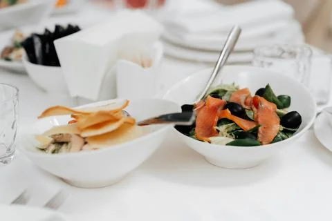 Appetizer. Cold table. dish of red fish on the table with salads and greens Stock Photos