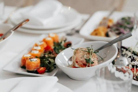 Appetizer. Cold table. dish of red fish on the table with salads and greens Stock Photos