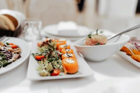 Appetizer. Cold table. dish of red fish on the table with salads and greens Stock Photos