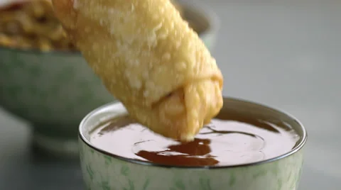Appetizer falling in bowl of sauce Stock Footage 46668865