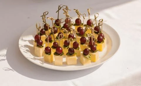 Appetizer with grapes and cheese. Canape Stock Photos