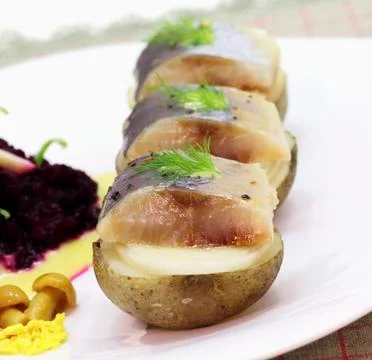 Appetizer with herring Stock Photos