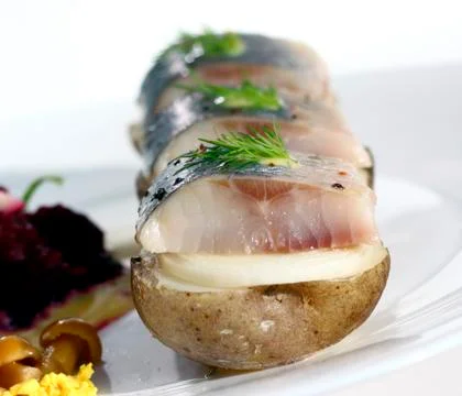 Appetizer with herring Stock Photos