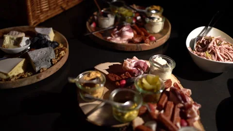 Appetizer with meat and cheese on a dark background Stock Footage 146324906