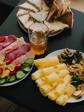 Appetizer plate with cheese, appetizer features deli meats and olives, appetizer Stock Photos