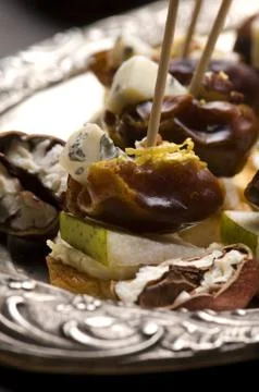 Appetizer Plate with Dactyl, Pecan nuts and Cheese Stock Photos
