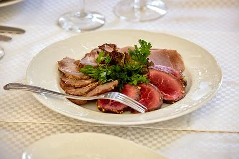 Appetizer plate with a meat selection. Sliced baked ham. Фото