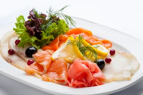 Appetizer of salted fish on white background Stock Photos