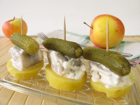 Appetizer of small herring rolls Stock Photos