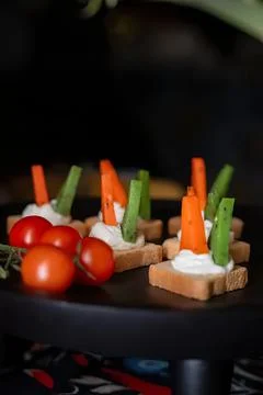 Appetizer snacks with cherry tomatoes and vegetable sticks Stock Photos