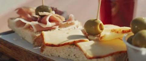 Appetizer snacks on a wooden board Stock Footage 152583131