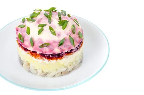Appetizer of vegetables, beets, pickled herring and mayonnaise. Stock Photos