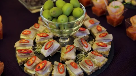 Appetizer for vodka pickled herring olives Red pepper Stock Footage 118298987