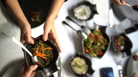 Appetizers are passed from hand to hand at the raki table in Istanbul Stock Footage 181053716
