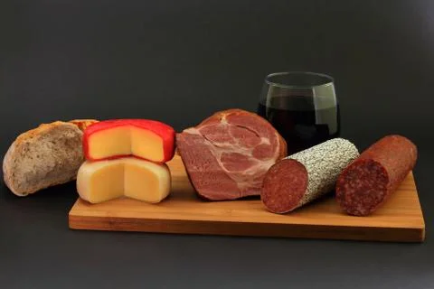 Appetizers, Cheese, Bread and Red wine Stock Photos