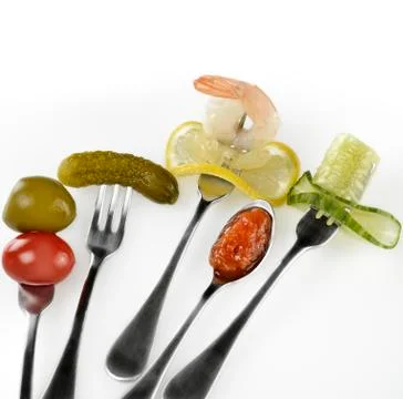 Appetizers on the forks Stock Photos