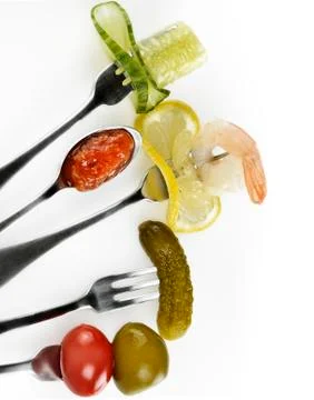 Appetizers on the forks Stock Photos