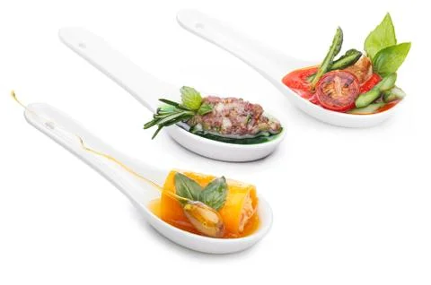 Appetizers in spoons Stock Photos