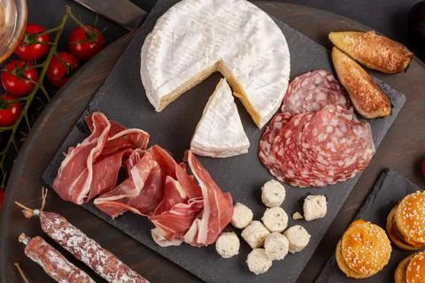 Appetizers table with differents antipasti, cheese, charcuterie, snacks and.. Stock Photos