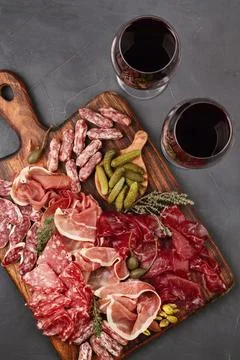 Appetizers table with differents antipasti, cheese, charcuterie, snacks and.. Stock Photos