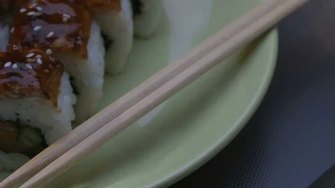 Appetizing amazing "Dragon" square sushi rolls with eel, salmon, cucumber, nori Stock Footage 75034530