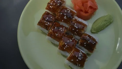 Appetizing amazing "Dragon" square sushi rolls with eel, salmon, cucumber, nori Stock Footage 75183815