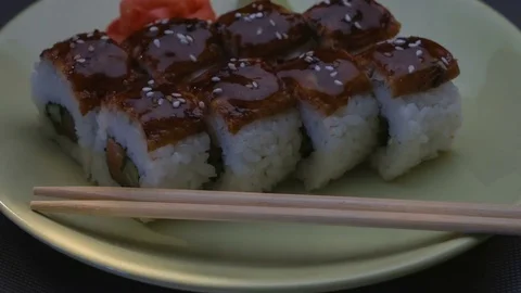 Appetizing amazing "Dragon" square sushi rolls with eel, salmon, cucumber, nori Stock Footage 75199022