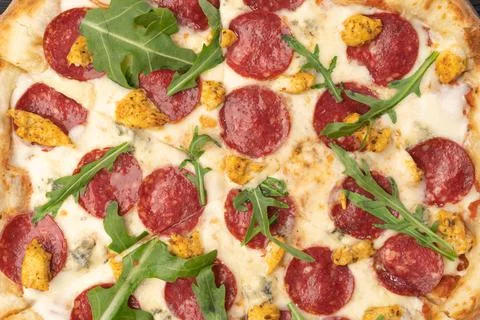Appetizing background pepperoni pizza close up. Pizza background Stock Photos