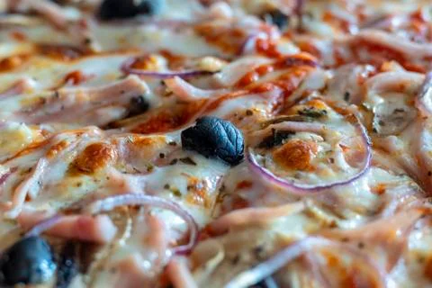 Appetizing background pepperoni pizza closeup filling the frame. Stock Photos