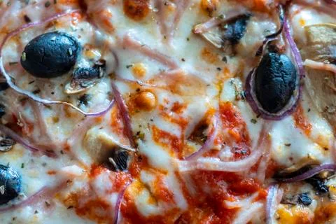 Appetizing background pepperoni pizza closeup filling the frame. Stock Photos