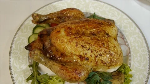 Appetizing baked chicken with vegetables on a beautiful plate Stock Footage 70229148