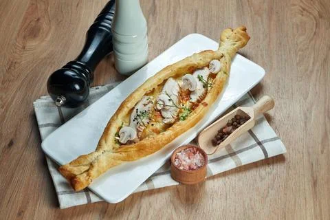 Appetizing baked open pie with salted suluguni cheese, chicken and mushrooms  Stock Photos