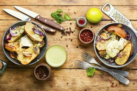 Appetizing baked potatoes Stock Photos