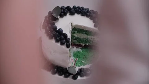 Appetizing big fresh pastry cake covered by white cream icing and decorate sweet Stock Footage 149288048