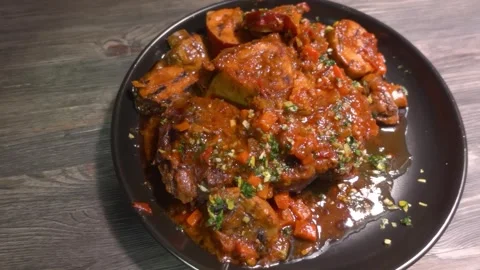 Appetizing braised Osso Buco steak with Gremolata garnish Stock Footage 312795058