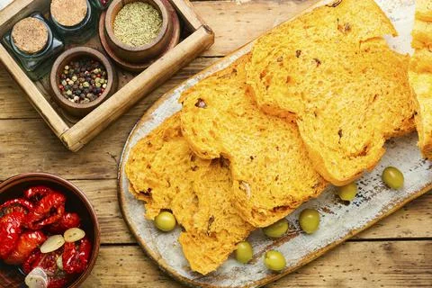Appetizing bread with sun dried tomatoes and olives Stock Photos