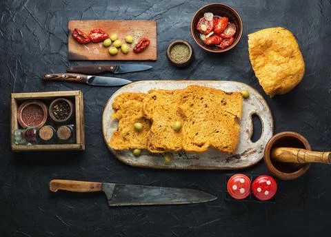 Appetizing bread with sun dried tomatoes and olives Stock Photos