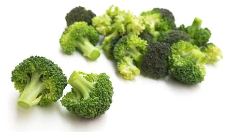 Appetizing broccoli inflorescences on a white background Stock Photos