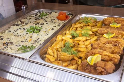 Appetizing buffet display with fried chicken, roasted potatoes, and savory .. Stock-Fotos