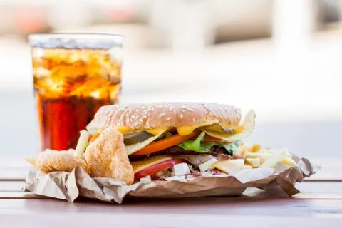 Appetizing burger and cold drink Stock Photos